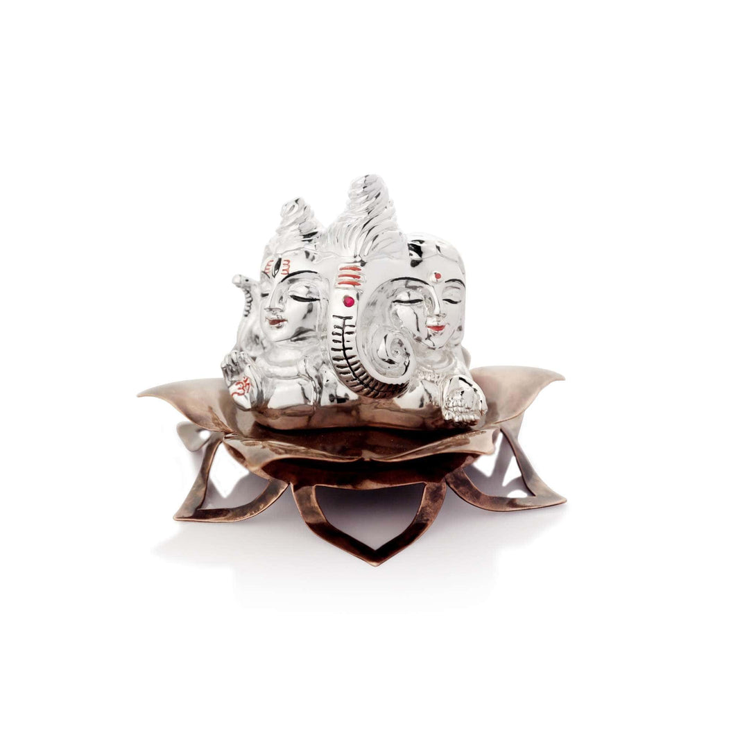 Ganesh Gauri Shankar merges three faces into one sterling silver relief carving, Shiva&