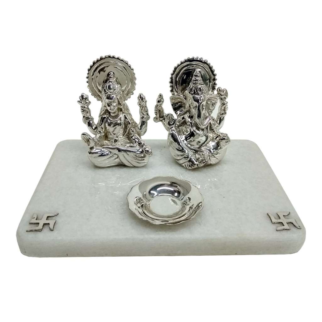 Laxmi Ganesh Mandir Traditional sits sterling silver Lakshmi and Ganesha idols side by side, each framed by a rounded silver halo - white background