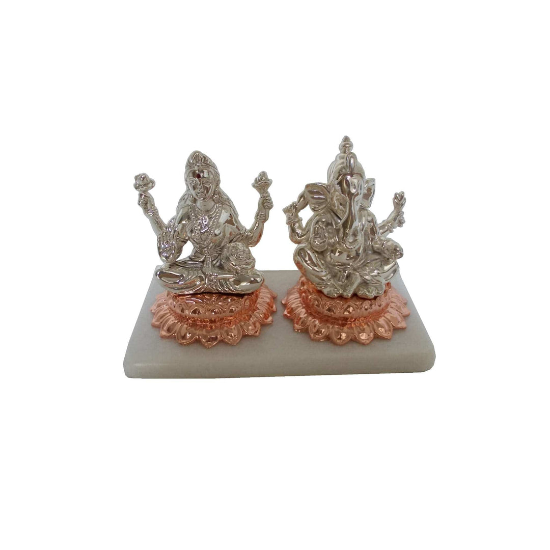Laxmi Ganesh On Lotus seats sterling silver Lakshmi and Ganesha idols each on their own rose-gold toned lotus pedestal - white background