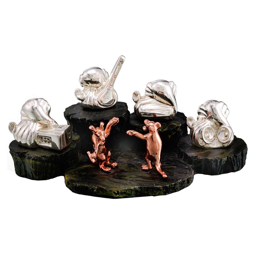 Ganesh Geet Mandali gathers four miniature sterling silver Ganesha idols, each holding a different instrument - white background
