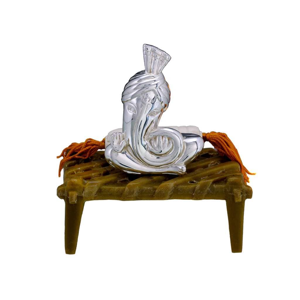 Ganesh Sarpanch dresses a sterling silver Ganesha idol as a village sarpanch - white background