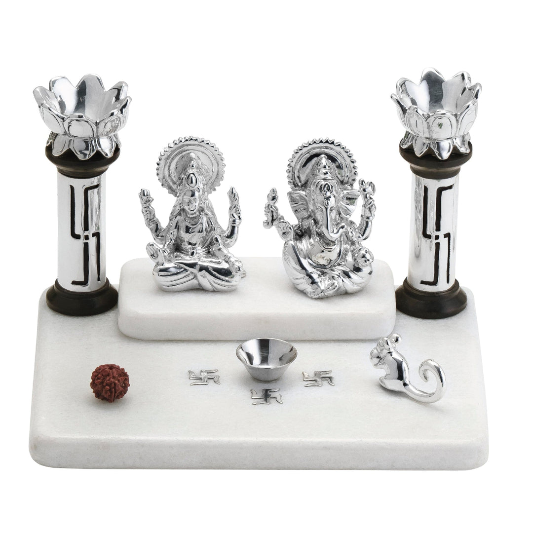 Vinayak Mandir Small sits sterling silver Lakshmi and Ganesha idols side by side on a raised marble platform under a two-tier mandir structure - white background
