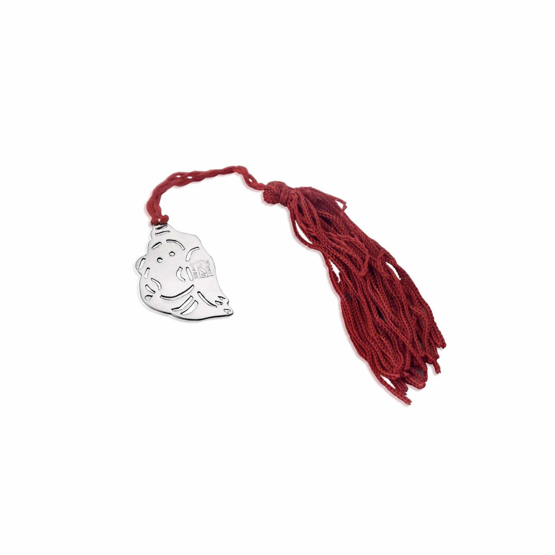 Bookmark Baby Ganesh is a sterling silver bookmark cut into the silhouette of a seated, chubby-cheeked baby Ganesha - white background