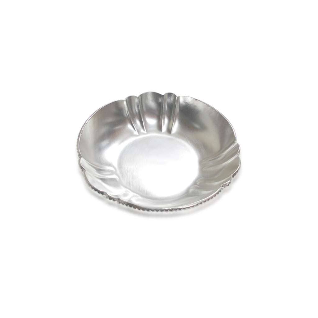 Aster Bowl Halwa is a silver dish with a petal-scalloped rim, curving into soft points around a beaded edge and a smooth centre - white background
