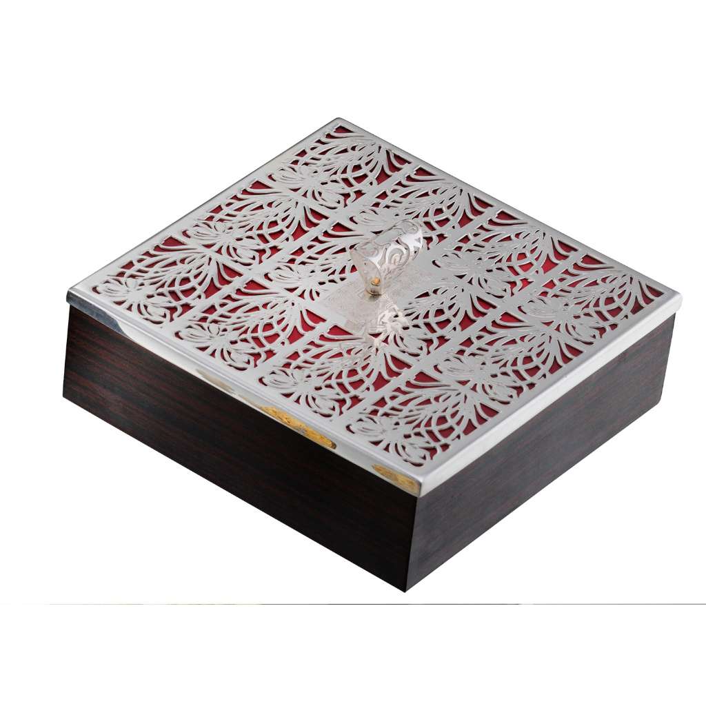 Box Lilien is a silver box with an intricately pierced lid paired with a seasoned rosewood base – Small