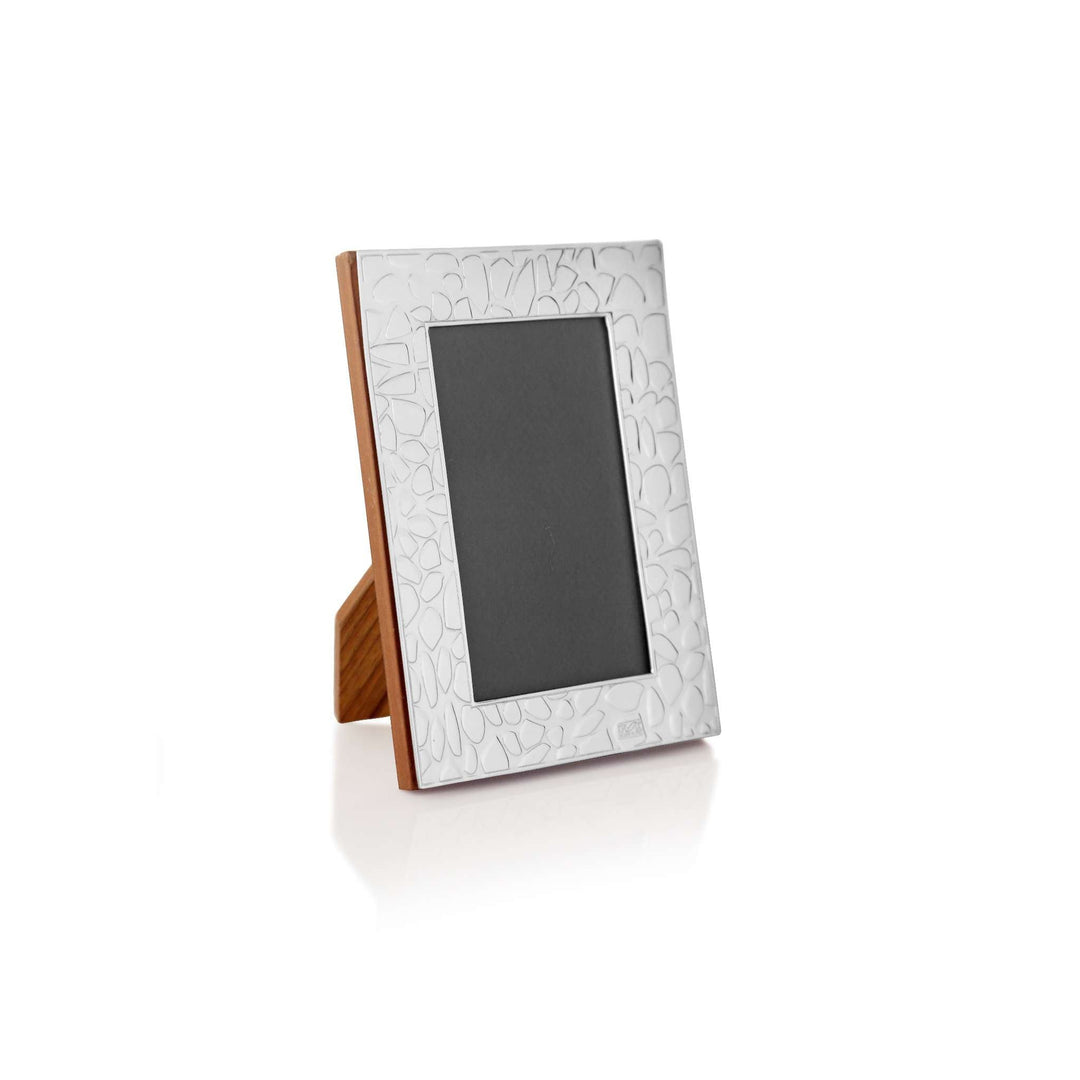 Photo Frame Cobbled engraves a cobblestone-like texture across the border of this silver frame – Small