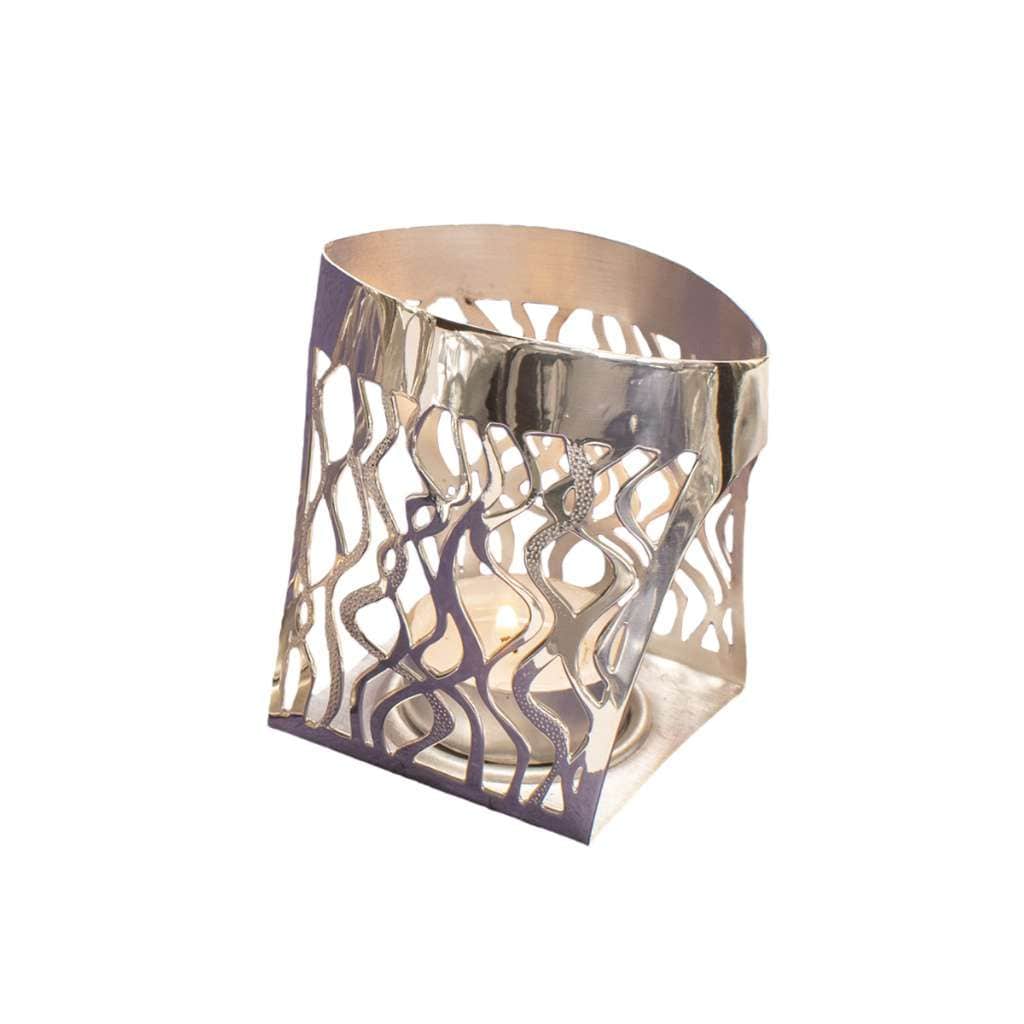 Tea Light Confetti is a silver tea light holder with a warm gold-toned finish – Small