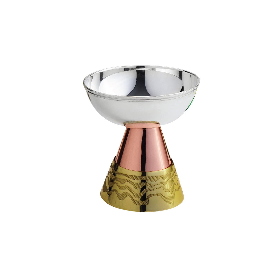 Tower Bowl sets a wide, shallow silver bowl on a striking two-tone stand, its rose-copper neck giving way to a wave-textured brass base – Medium