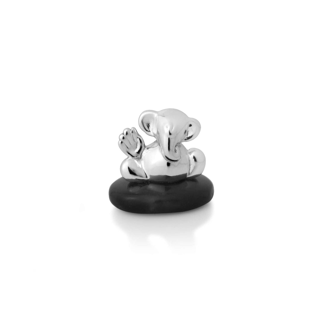 Ganesh Natkhat, meaning mischievous, is a small sterling silver Ganesha idol reclining on one arm with the other raised in blessing – Small