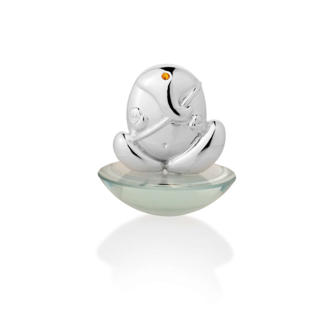 Ganesh Pebble shapes Ganesha as a smooth, rounded pebble, a sterling silver idol marking the eye with a single citrine-toned stone – Small