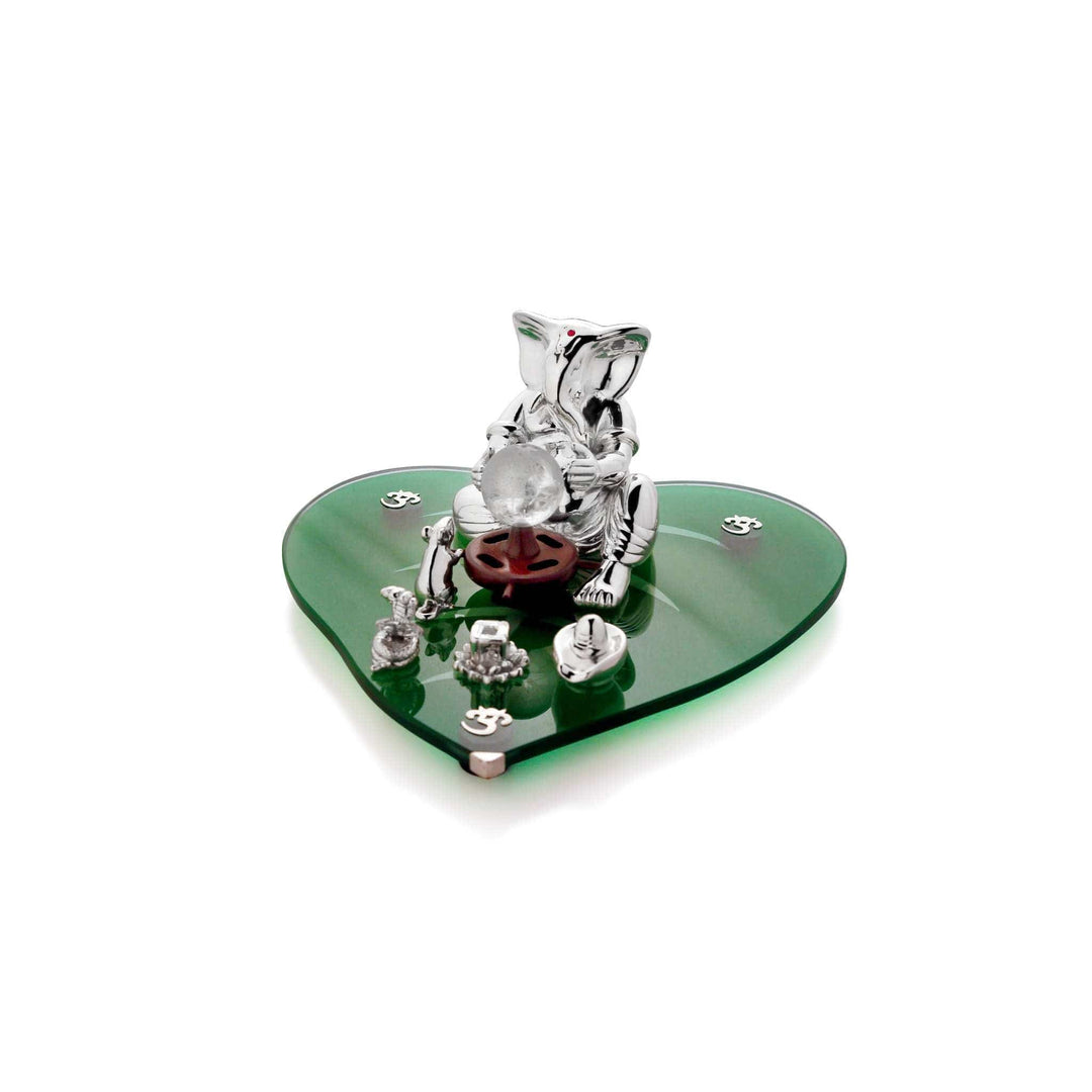 Ganesh Rachaitaa, meaning the creator, is a sterling silver Ganesha idol cradling a crystal globe, surrounded by a small silver cobra – Small