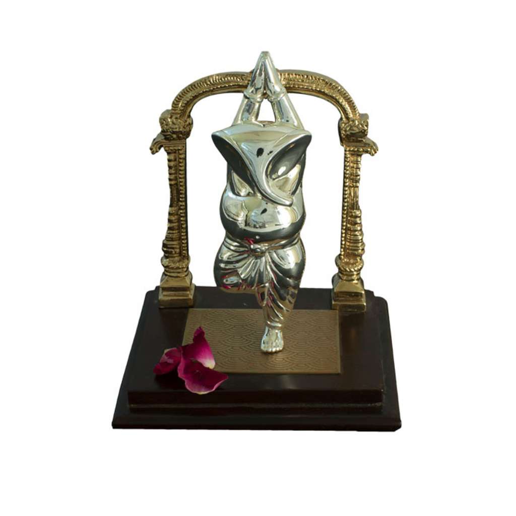 Ganesh Yogeshwar balances a sterling silver Ganesha idol in a yoga tree pose, standing on one leg with hands folded above his head – Small